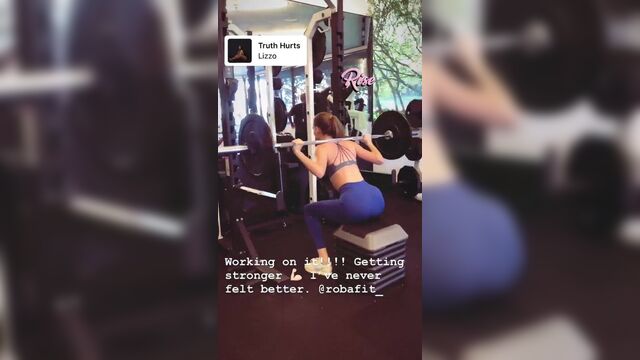 Madison Lintz lifting weights at the gym