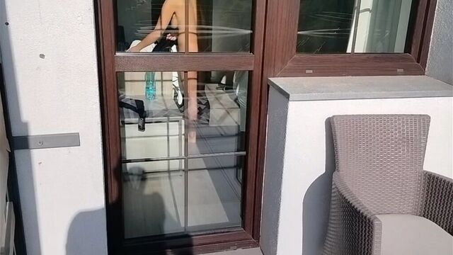 I spy on my neighbor and play with my cock. She opens the door and starts playing with his cock too.