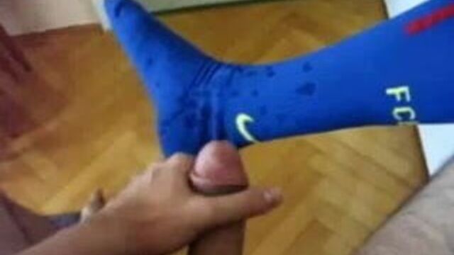 Cumming on blue soccer socks
