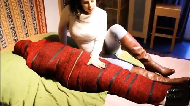 Mummified, bound and cuddled by woman