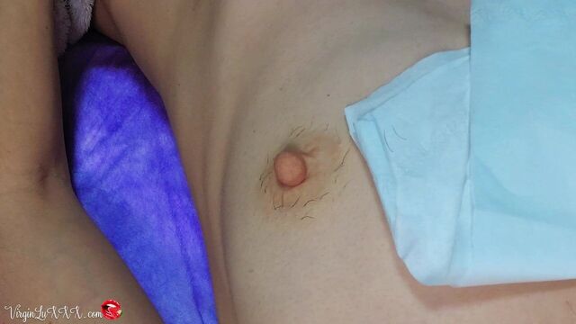 Man Beautician Plucks Hair on Nipples of Girl on Depilation